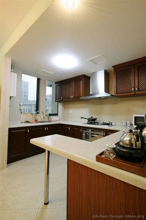 Empty wooden table and blurred background of abstract in front of coffee shop or restaurant for. Pictures of Kitchens - Modern - Dark Wood Kitchens