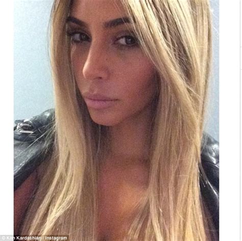 kim kardashian flaunts her blonde wig as she poses for pictures with fans daily mail online
