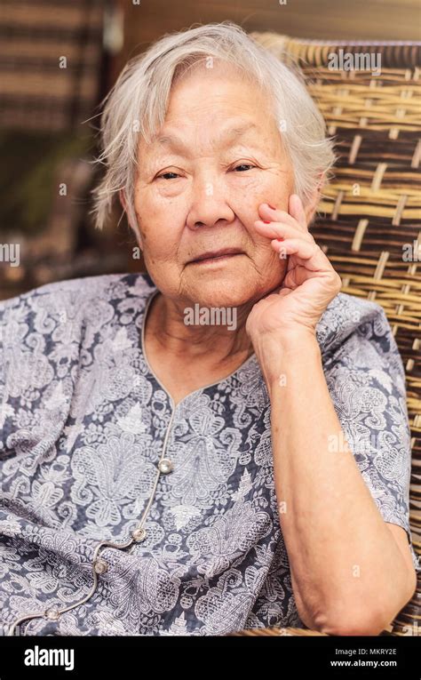 Portrait Of A Obaasan Grandma Seated Posing With The Hand On Chin