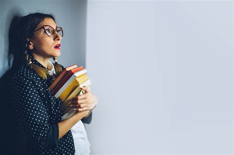 Scared Nerd Girl With Big Glasses Holding Books Stock Photo Download