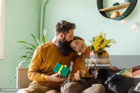 couple making out on couch photos and premium high res pictures getty images