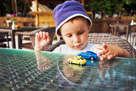 Toddler Playing With Toy Cars Stock Photo Image Of People Drive