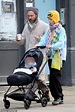 Jude Law enjoys a stroll with daughter Iris and his three-month-old ...