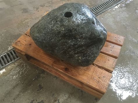 There is nothing like the appeal of running water in a landscape to quiet the city din and enable us. Drilled glacial boulder water feature | Water Feature ...