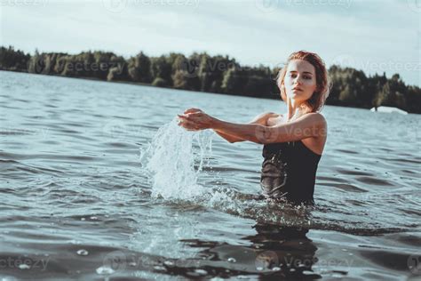 Young Beautiful Woman Standing In The Water 3305343 Stock Photo At