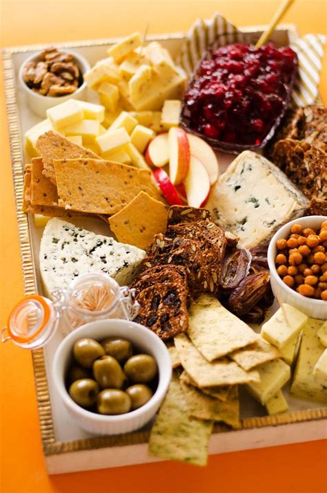 Pair a variety of cheeses with fruits, nuts, crackers, and spreads for the ultimate appetizer platter. Vegetarian Cheese Board with Crunchy Roasted Chickpeas