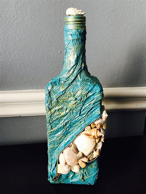 I love glass bottle craft ideas! Wine Bottle Decor.Home Decor.Glass Bottle Art.Seashells ...