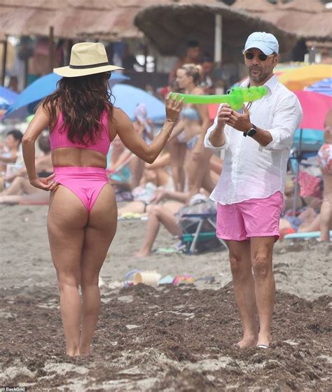 Eva Longoria Shows Off Her Toned Figure In A Plunging Hot Pink Swimsuit