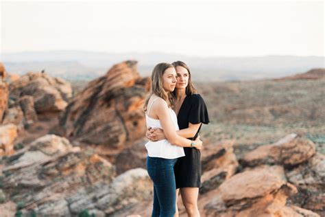 Engagement Photos On Red Rock Sandstone Cliffs Of Snow Canyon