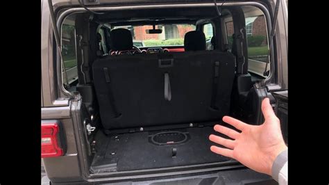 The part of the trunk of the 4. 2 door JL Wrangler back seat/storage space and answering ...