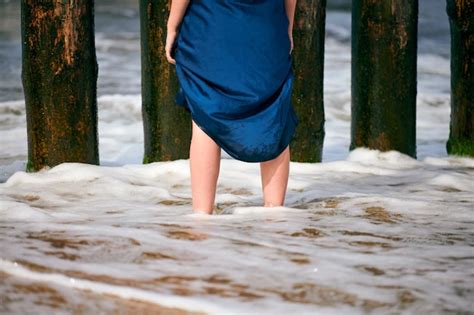 Premium Photo Legs Of Young Beautiful Woman In Long Dark Blue Dress