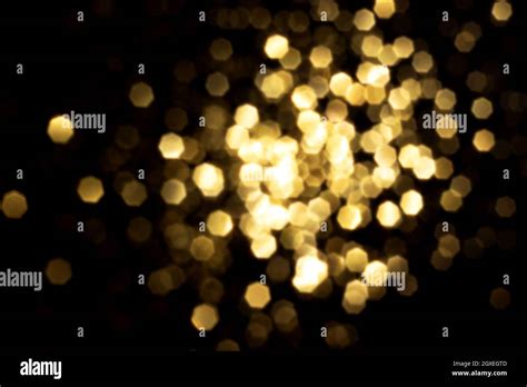 Golden Blurred Bokeh Lights On Black Background Glitter Sparkle Stars