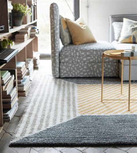 A Square Rug With A Geometric Cube Pattern In Yellow And Gray Nyc