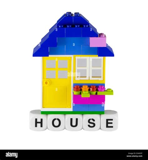 A Little Toy House With Yellow Door Stock Photo Alamy