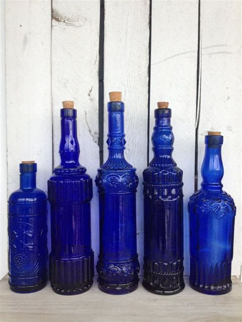 Vintage Cobalt Blue Glass Bottles Blue Supply By Mellafina Antique Glass Bottles Glass Bottles