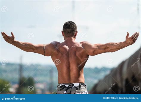 BodyBuilder Posing Double Biceps Stock Photo Image Of Back Male