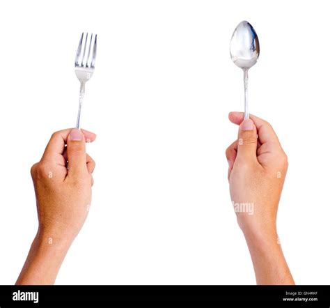 Hands Holding Spoon And Fork Stock Photo Alamy