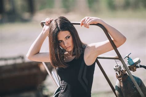 Portrait Of Fashion Model Girl On The Industrial Background Stock