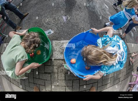 The Traditional Game Of Apple Bobbing At A London Street Party Stock
