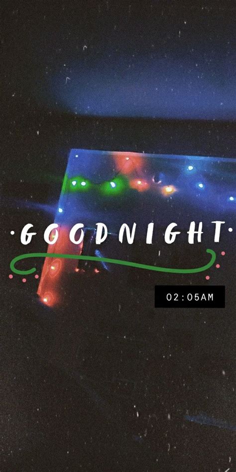 An Illuminated Sign With The Words Good Night On It In Front Of A Dark