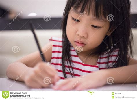 Asian Chinese Little Girl Drawing On Paper Stock Image Image Of Asian