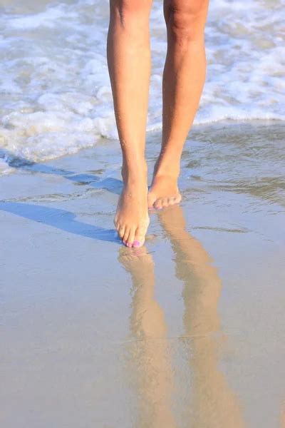 Female Legs Walking On The Sea Beach Stock Photo Valuavitaly