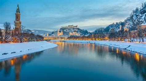 Historic City Of Salzburg With Salzach River In Winter During Blue Hour