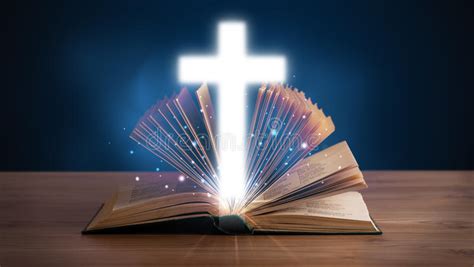 Open Holy Bible With Glowing Cross In The Middle Stock Photo Image Of