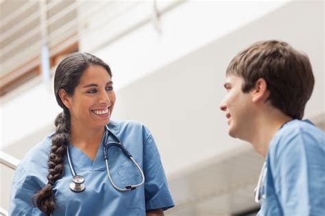 Premium Photo Female Nurse Talking With A Male Nurse