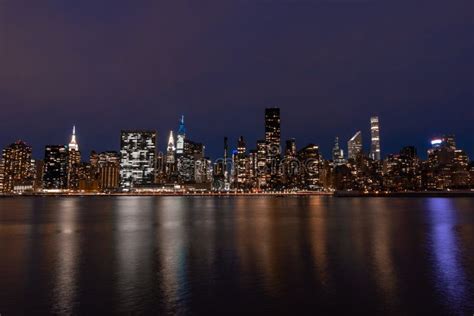 Nighttime Midtown Manhattan Skyline Along The East River In New York