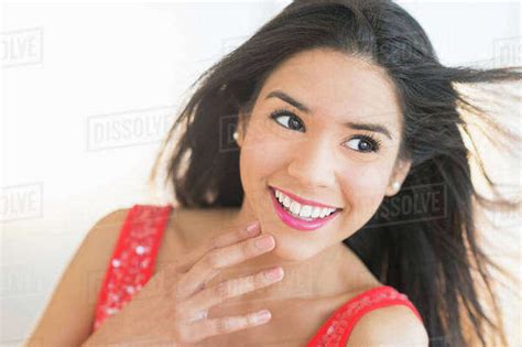 Close Up Portrait Of Smiling Hispanic Woman Stock Photo Dissolve