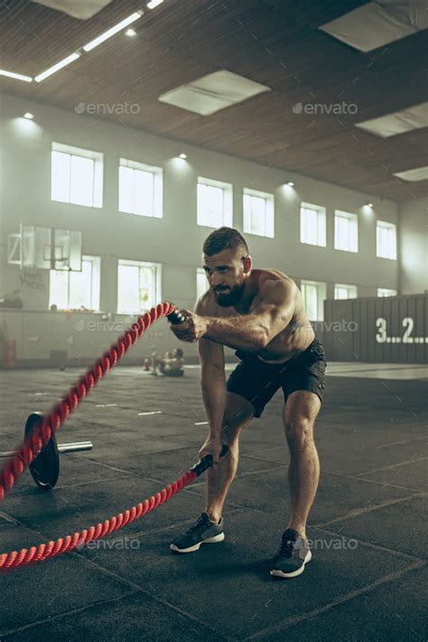 Men With Battle Rope Battle Ropes Exercise In The Fitness Gym Stock