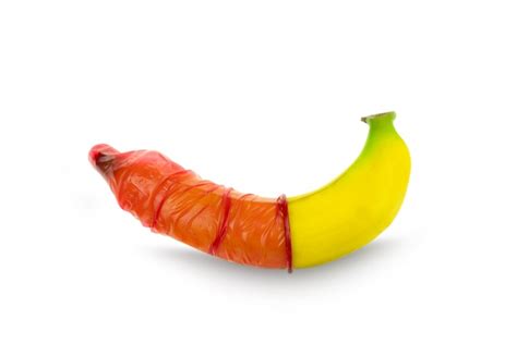 Premium Photo Red Condom Wear A Banana Concept Safe Sex Prevention Of