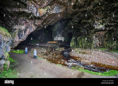 Tourists Visiting Smoo Cave Large Combined Sea Cave And Freshwater