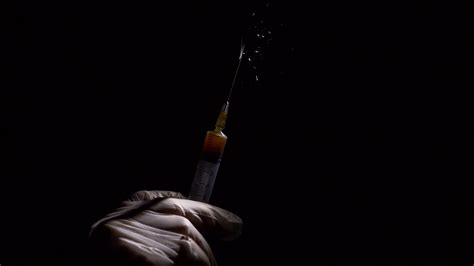 Close Up Liquid Substance In Syringe Drug Injection Stock Video