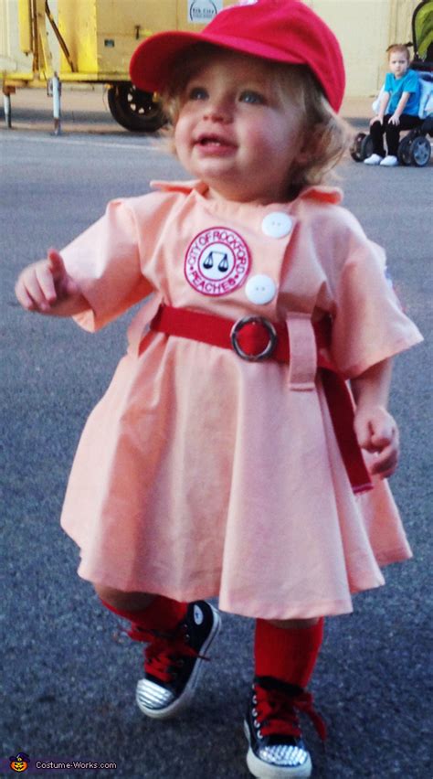 Embroidered patches sewn to bodice front & left sleeve. A League of Their Own - Baby Halloween Costume - Photo 2/2