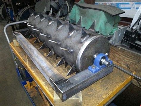 A spike aerator has sharp tines that penetrate the ground to make holes and aerate. www.millerwelds.com resources project-gallery-details-page lawn-aerator ...