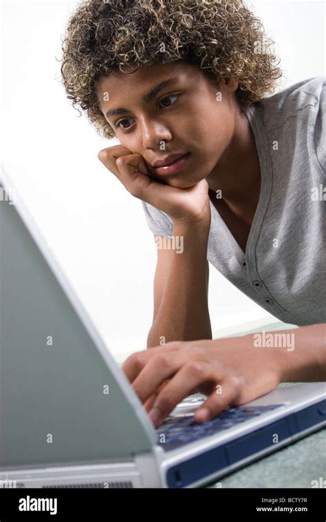 Mixed Race Black Teenage Boy On His Laptop Computer Stock Photo Alamy