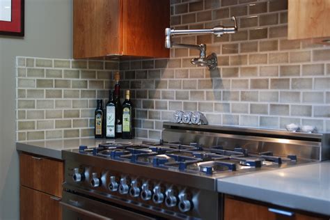 The backsplash was created with traditional white subway tile. What Why and How to Tile a Backsplash for Your Kitchen ...