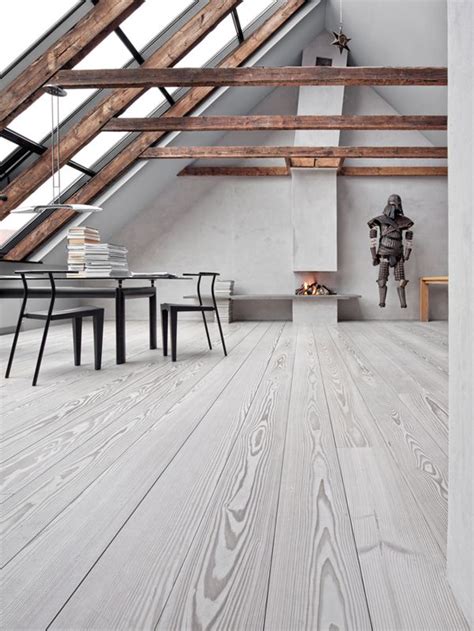 This matches with the hardwood ceiling that is complemented by the large stone panel of the fireplace facing the white sofa set. The Well-Appointed Catwalk: 13 Whitewashed Interiors to ...