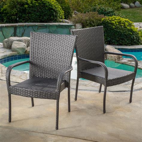 Combine armchairs with side chairs to surround your dining table and give options to your guests. Noble House Gray Stackable Wicker Outdoor Dining Chair ...