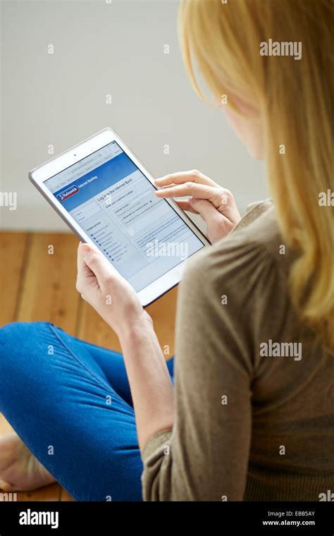 Woman Banking Online Using An Ipad Stock Photo Alamy