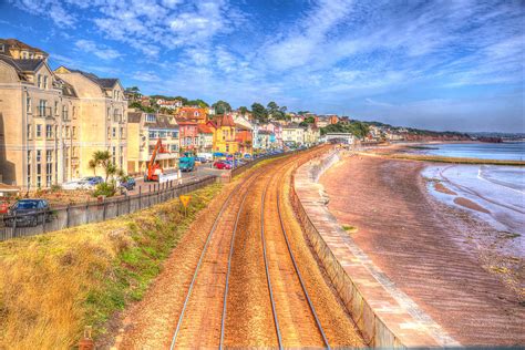 Dawlish Devon England With Beach Railway Track And Sea On Blue Sky