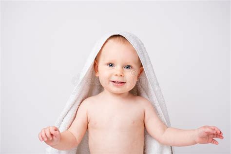 Little Boy Holding A White Towel Situation After Bathing Blonde Hair