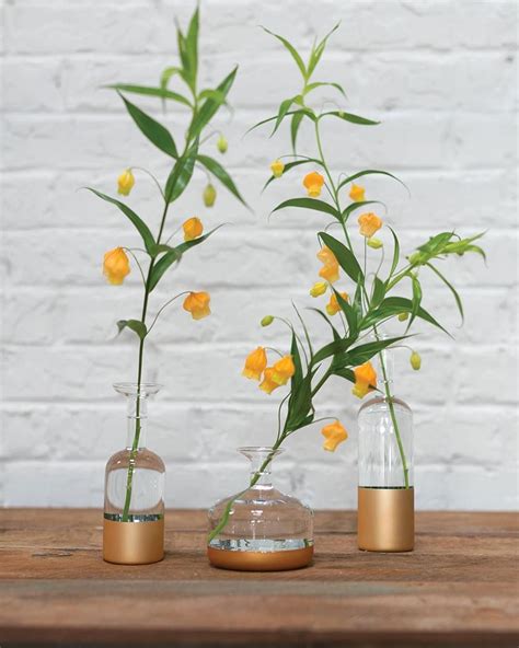 Gold Dipped Vases Filled With One Flower Each And You Have An Amazing