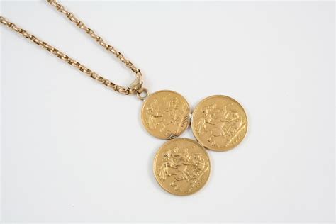 A Gold Sovereign Pendant Mounted With Two Sovereigns And One Half