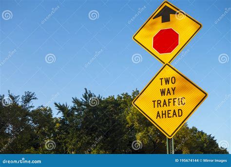 Double Street Sign Reading Two Way Traffic Ahead Sign With Exagonal