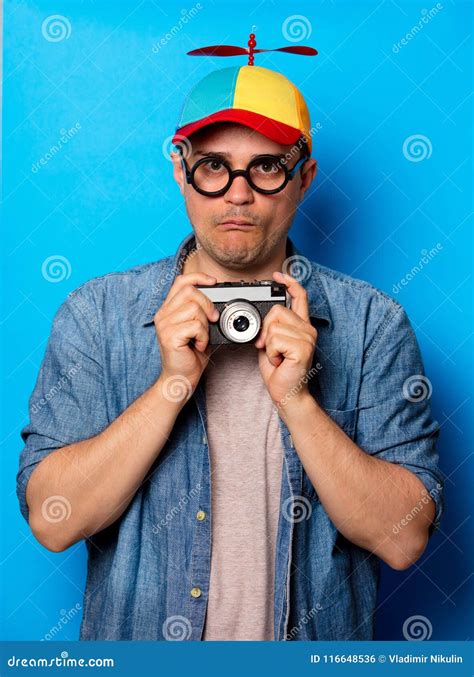 Young Nerd Man With Noob Hat Holding Camera Stock Photo Image Of