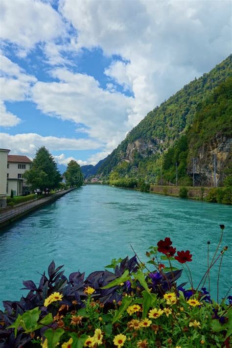 Turquoise View Of A River Flowing From Brienz Lake In Interlaken