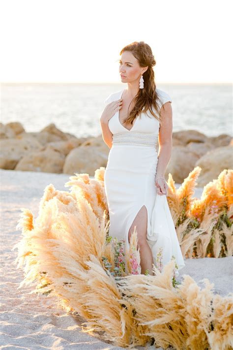 The jute pocketfold kept their wedding events itinerary and other enclosures close at hand for guests traveling to the bahamas for the celebration. Beautiful Beach Wedding Ideas Inspired By Pampas Grass